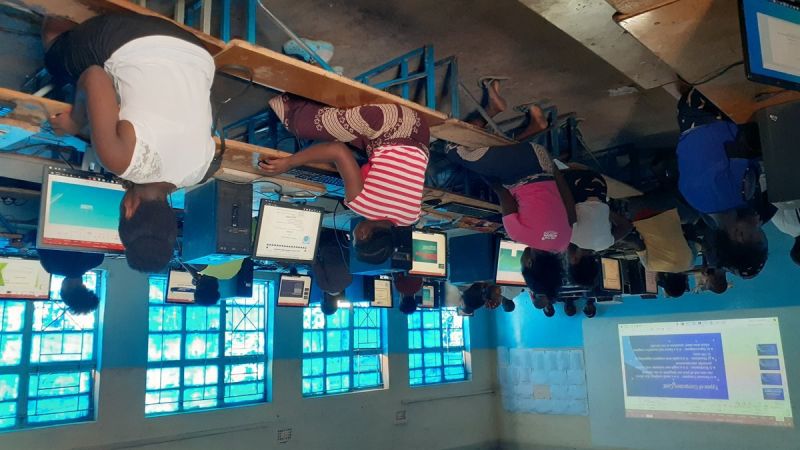 Students actively using computers in ICT lab with VALBRITE EDU